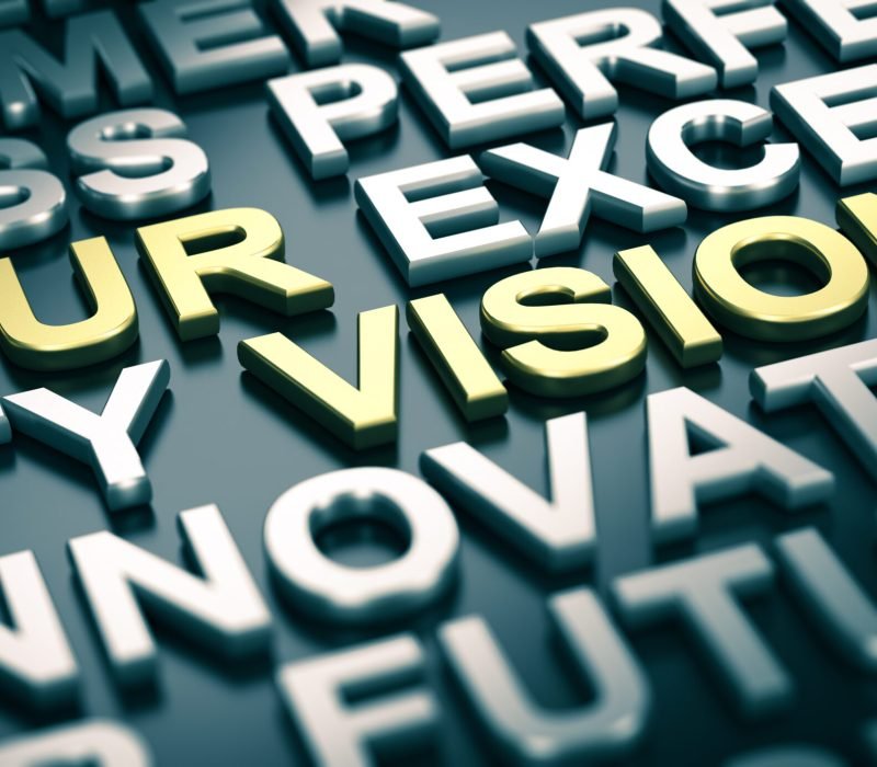 3D illustration of a company vision statement with blur effect and many positive words surrounding the main text