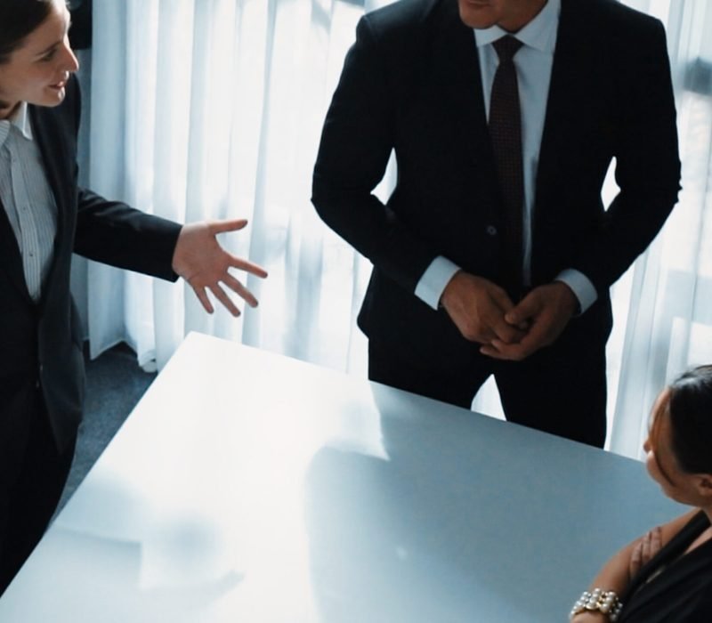 Top view of project manager looking at meeting table surrounded by diverse business people brainstorm and planning strategy. Group of smart people discussing and solve business problems. Directorate.